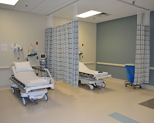 Hospital room with two empty beds.